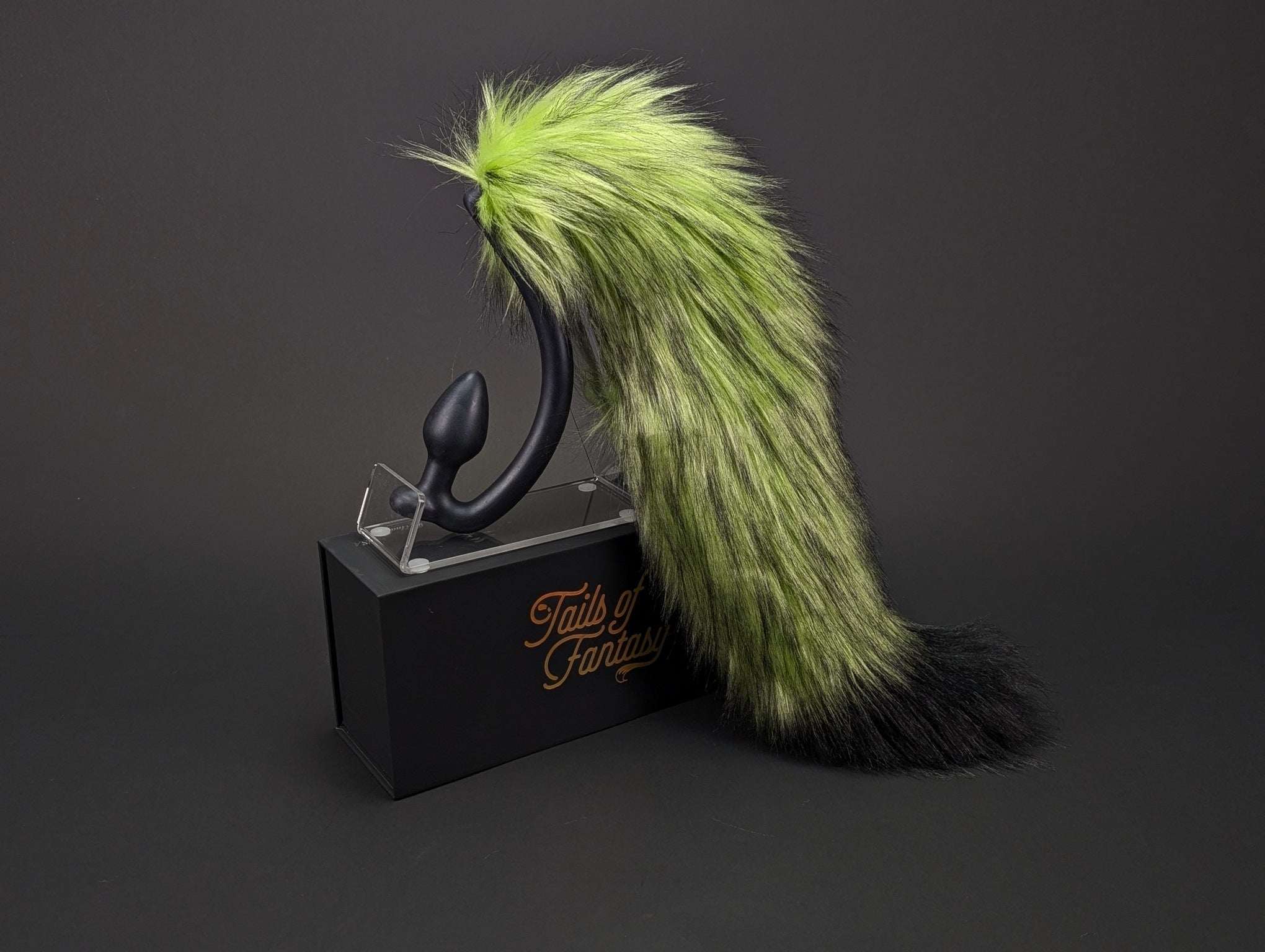 toxic-fox-tail fox tail butt plug in green and lime with realistic faux fur tail and raised tail design