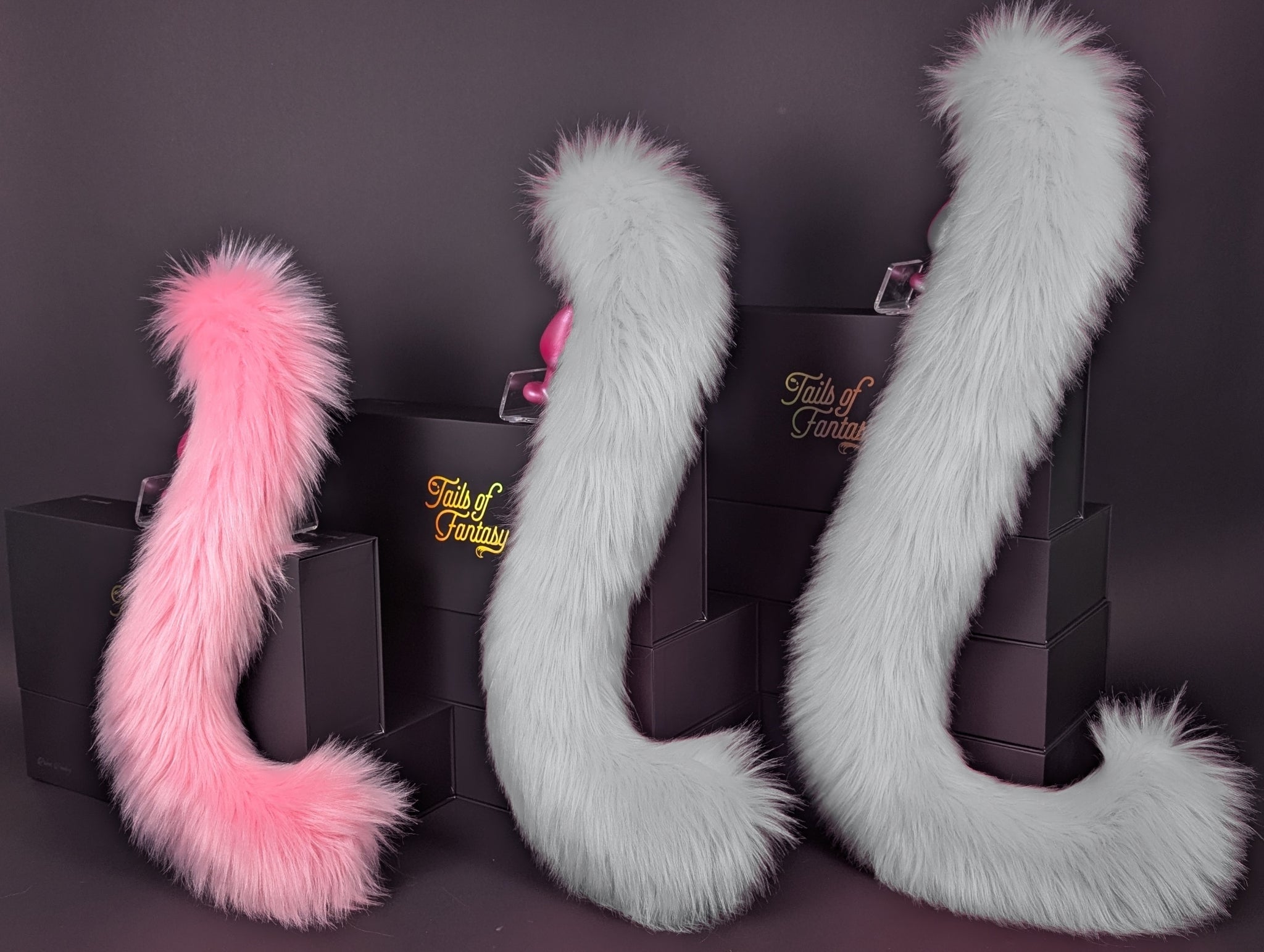 Tails of Fantasy Pink Lemonade Cat Tail - Long Hair body-safe silicone butt plug featuring a unique upright support design - (small plug) studio display of the Pink Lemonade Cat Tail - Long Hair.