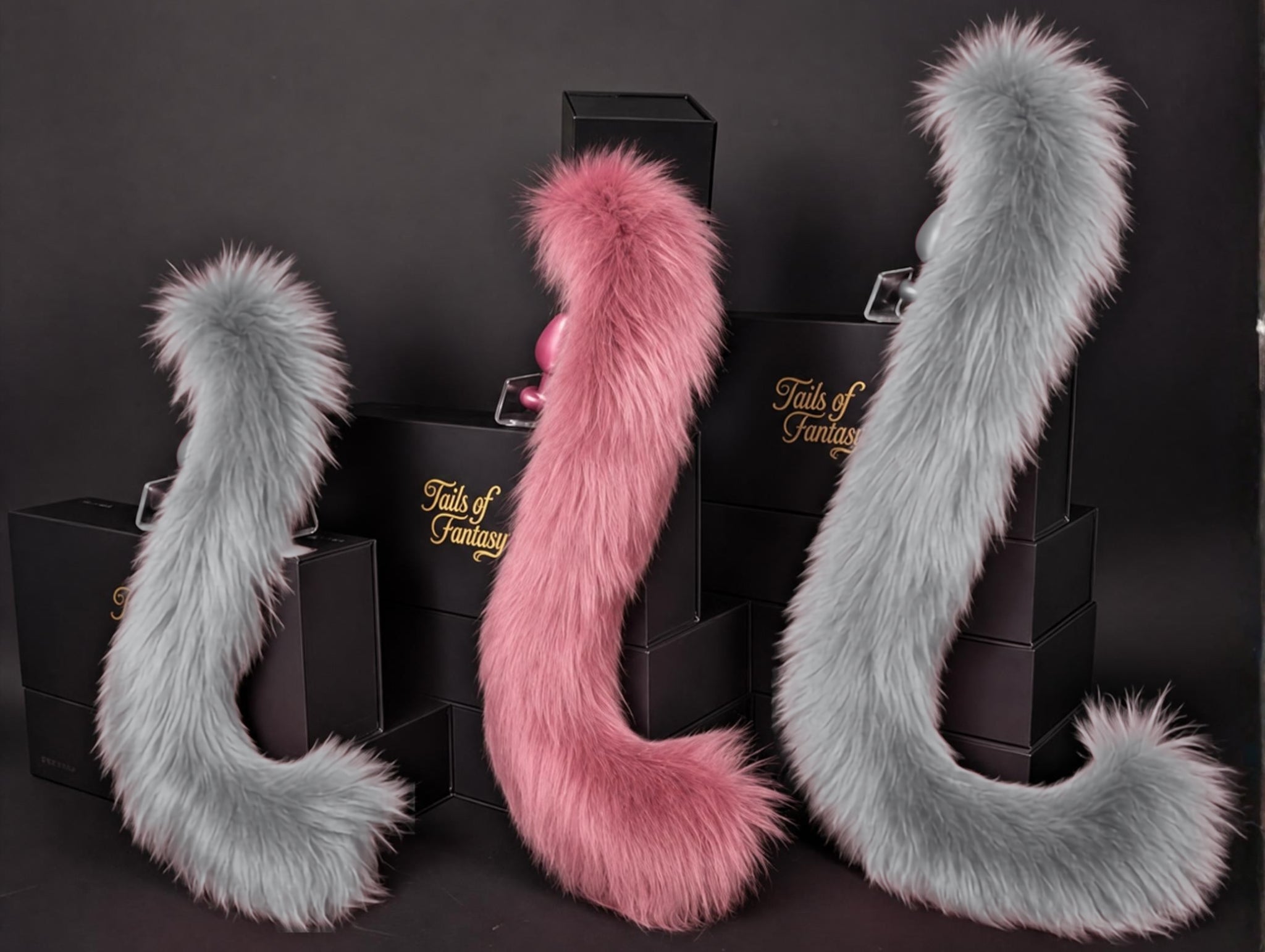 Tails of Fantasy Rose Pink Cat Tail - Long Hair body-safe silicone butt plug featuring a unique upright support design - (medium plug) studio display of the Rose Pink Cat Tail - Long Hair.