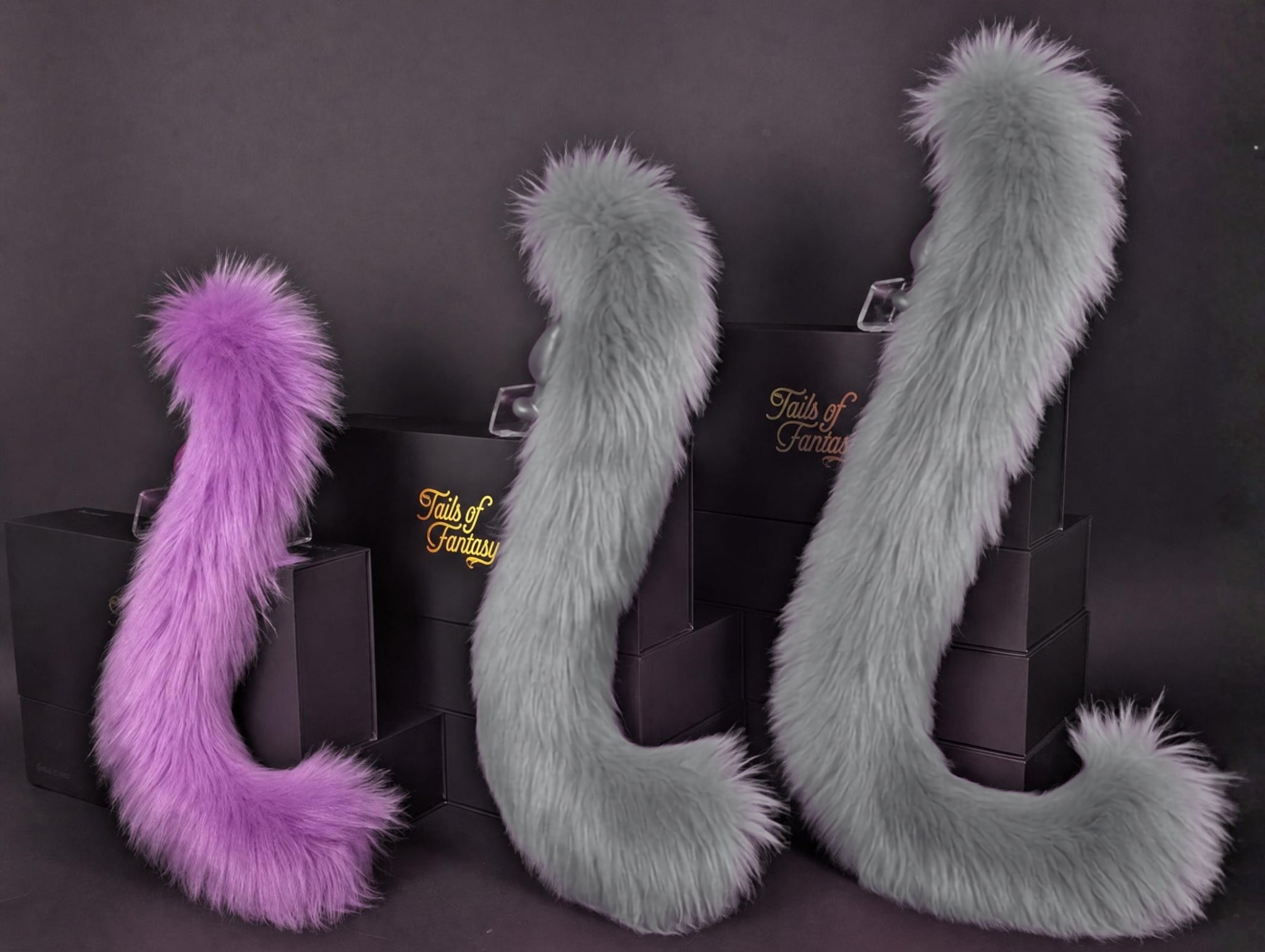 Tails of Fantasy Violet Cat Tail - Long Hair body-safe silicone butt plug featuring a unique upright support design - (small plug) studio display of the Violet Cat Tail - Long Hair.