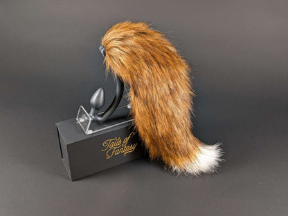 A very fancy fox tail, burnt red in color