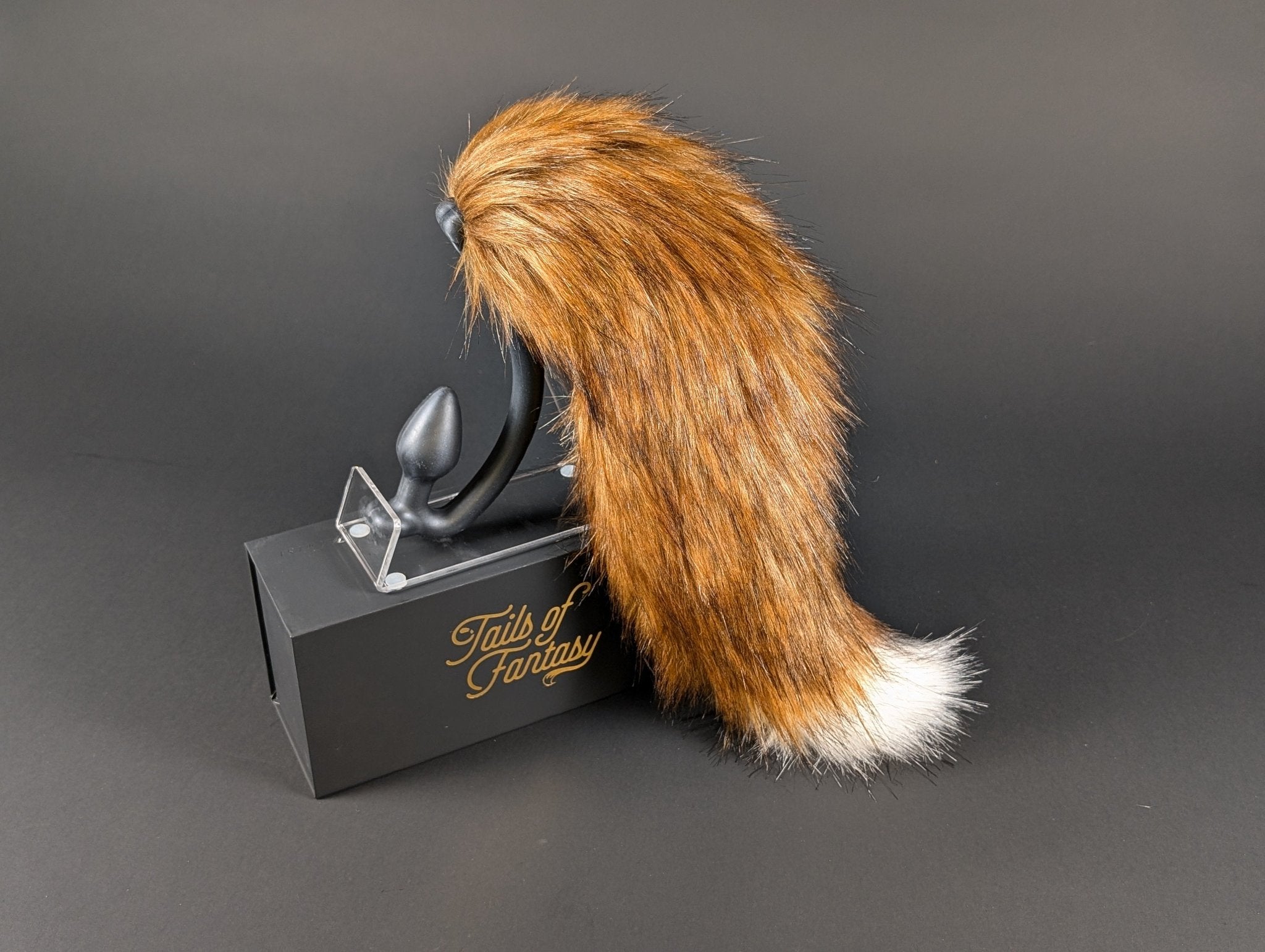 A very fancy fox tail, burnt red in color