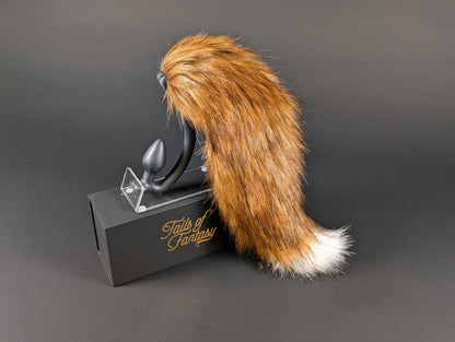 A very fancy fox tail, burnt red in color
