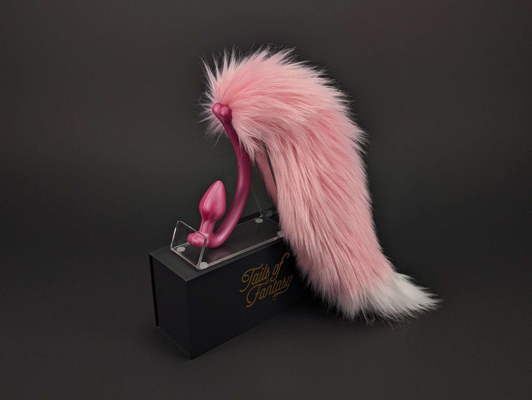 pink-lemonade-fox-tail fox tail butt plug in pink with realistic faux fur tail and raised tail design