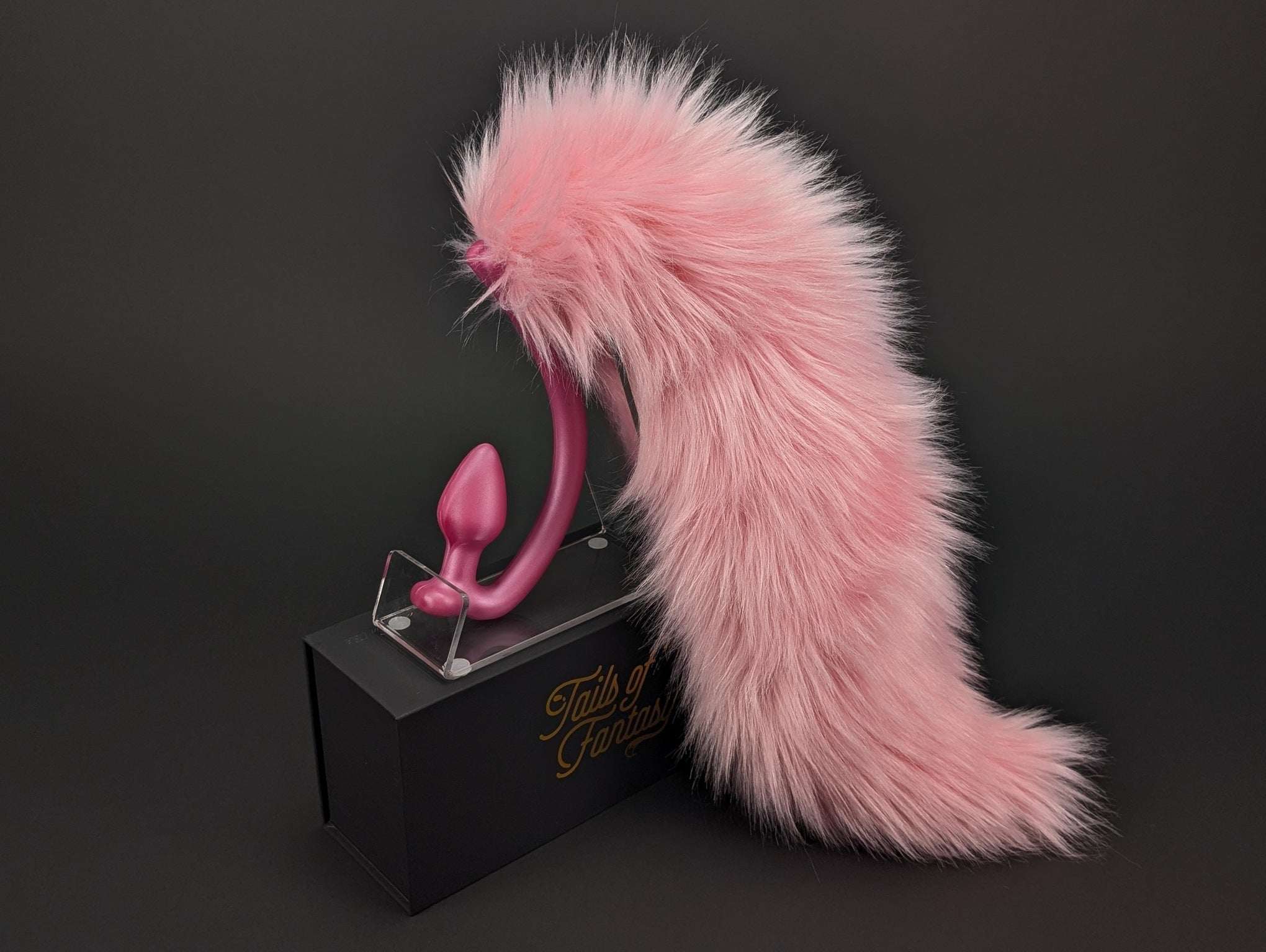 pink-lemonade-wolf-tail wolf tail butt plug in pink with realistic faux fur tail and raised tail design