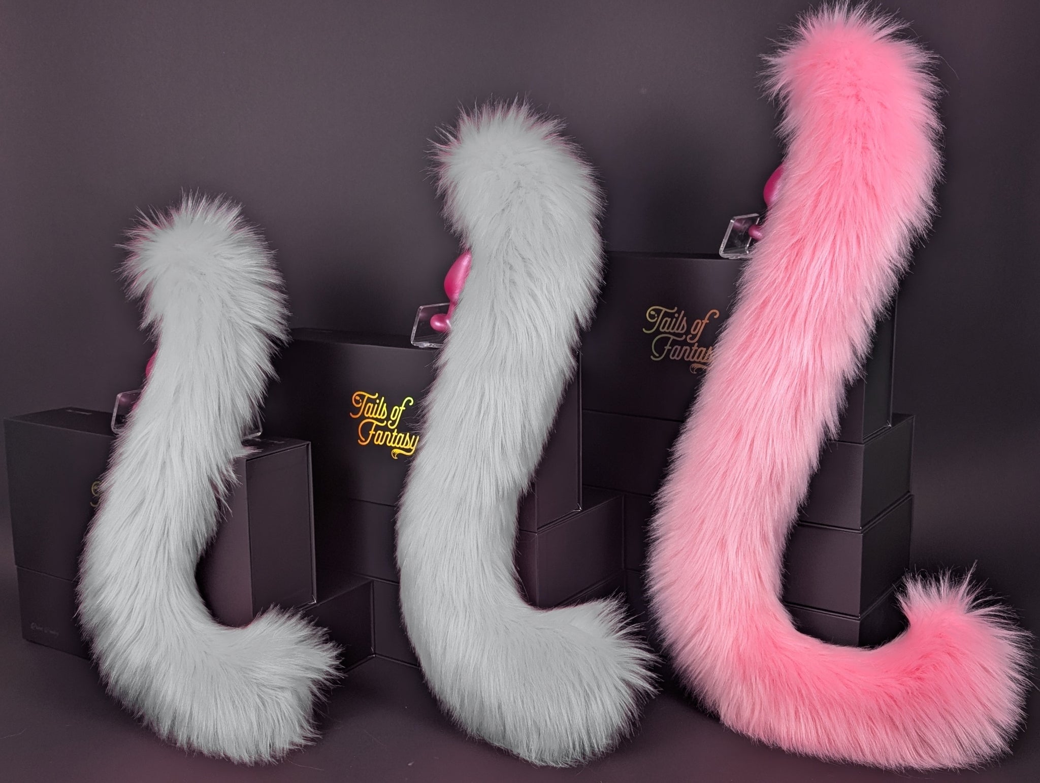 Tails of Fantasy Pink Lemonade Cat Tail - Long Hair body-safe silicone butt plug featuring a unique upright support design - (large plug) studio display of the Pink Lemonade Cat Tail - Long Hair.