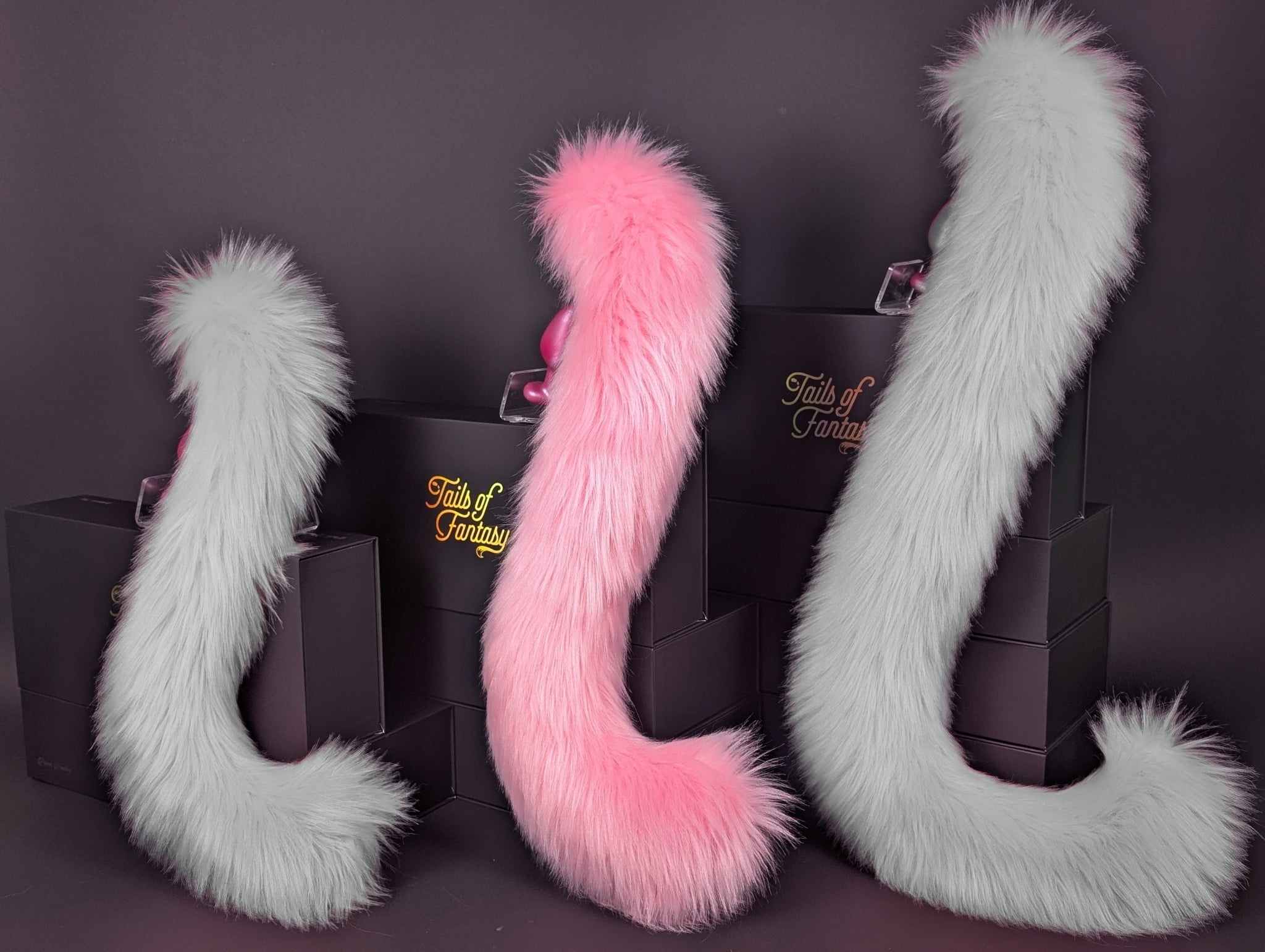 Tails of Fantasy Pink Lemonade Cat Tail - Long Hair body-safe silicone butt plug featuring a unique upright support design - (medium plug) studio display of the Pink Lemonade Cat Tail - Long Hair.