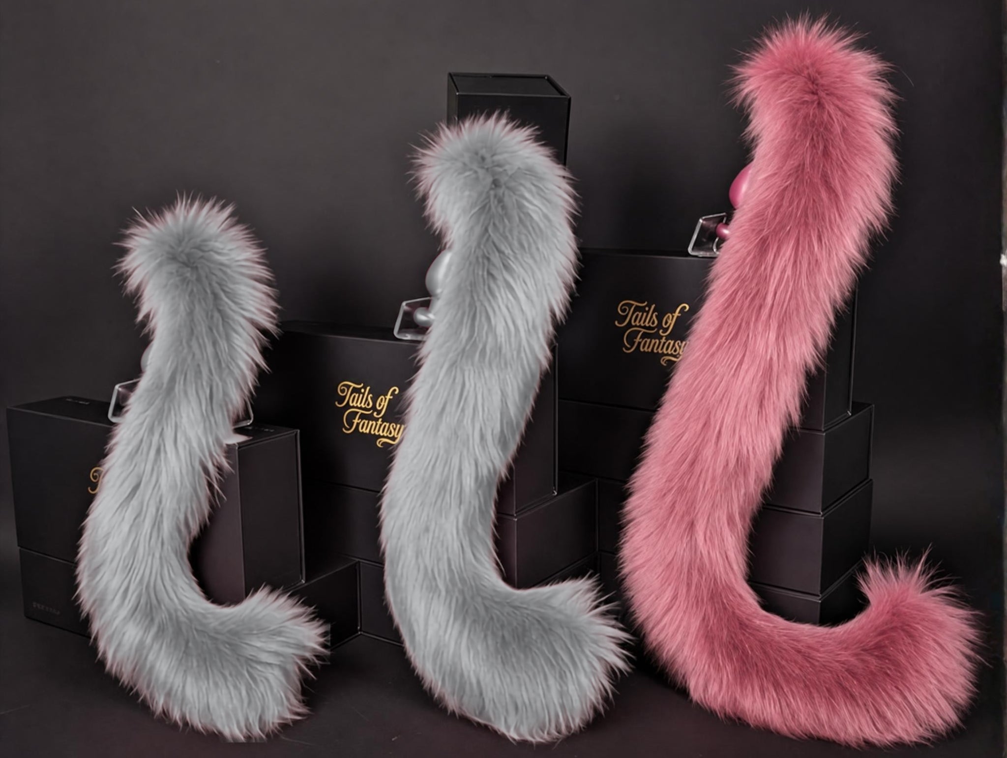 Tails of Fantasy Rose Pink Cat Tail - Long Hair body-safe silicone butt plug featuring a unique upright support design - (large plug) studio display of the Rose Pink Cat Tail - Long Hair.